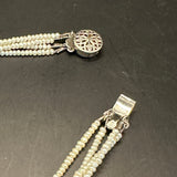 GG Pendant on Multi-Strand Freshwater Pearl Necklace