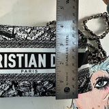 Black and white patterned fabric with 'Christian Dior' branding, chain strap