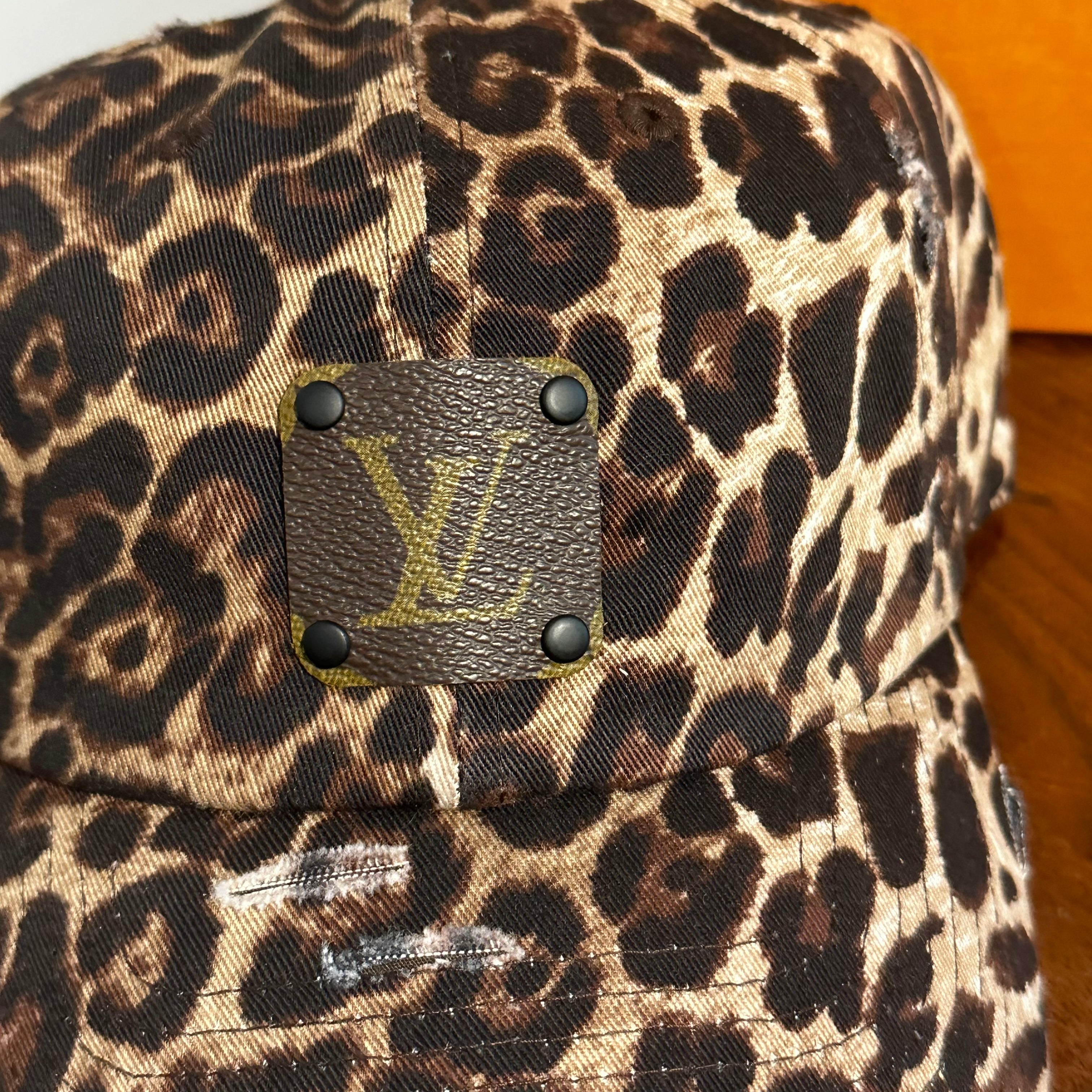 Upcycled LV Patch on Distressed Leopard Print Hat