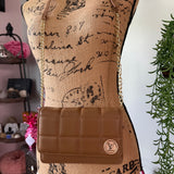 Tan quilted bag with vintage LV button