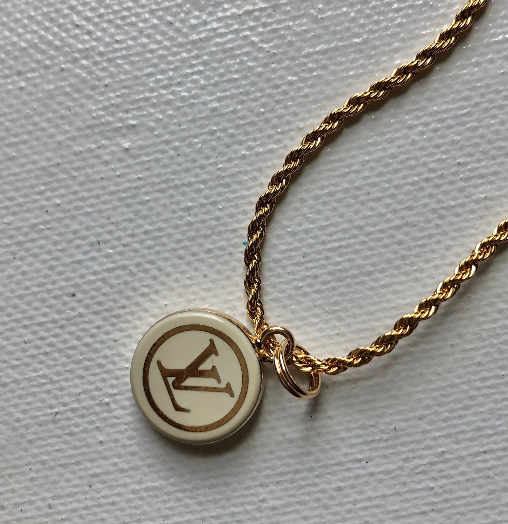 gold lv pendant