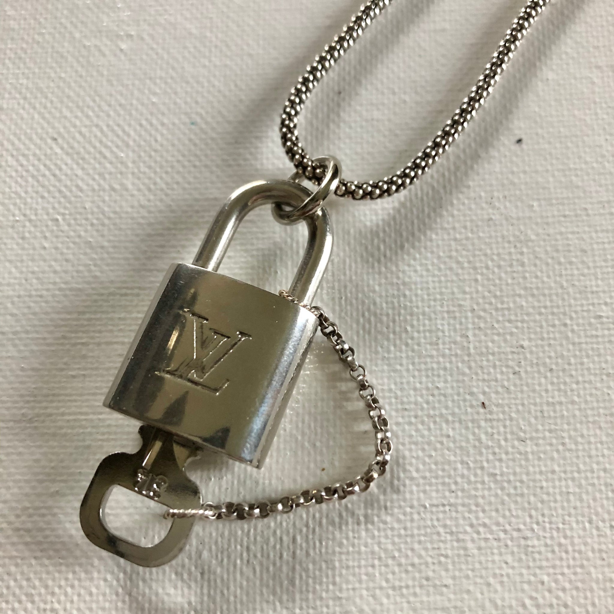 vuitton lock necklace silver
