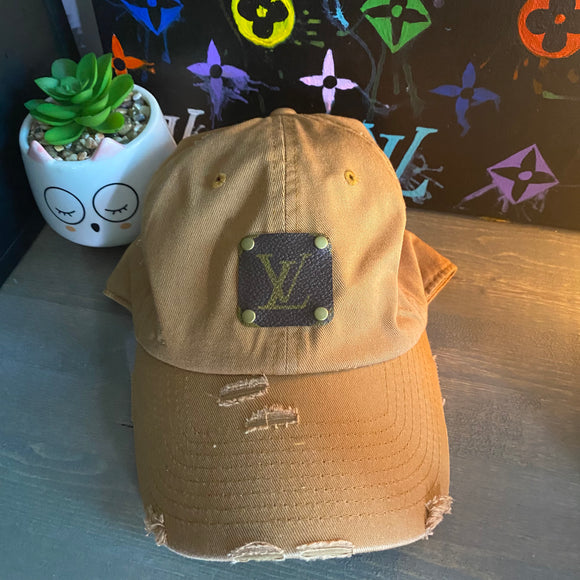 Black distressed hat with upcycled LV patch